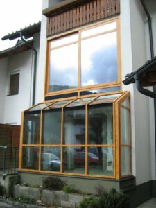 REMING - Zimní zahrada a hliníková okna v imitaci dřeva v Rakouském Tropolachu