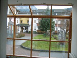 REMING - zimní zahrada a hliníková okna v imitaci dřeva v Rakouském Tropolachu