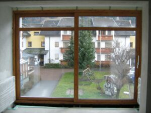 REMING - zimní zahrada a hliníková okna v imitaci dřeva v Rakouském Tropolachu